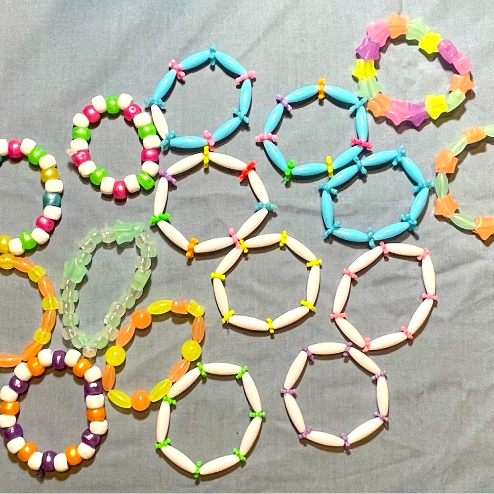 Assorted color kids’ bracelets. Sold together.